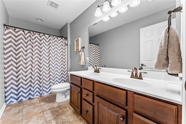 bathroom with vanity, tile patterned floors, toilet, and a shower with shower curtain