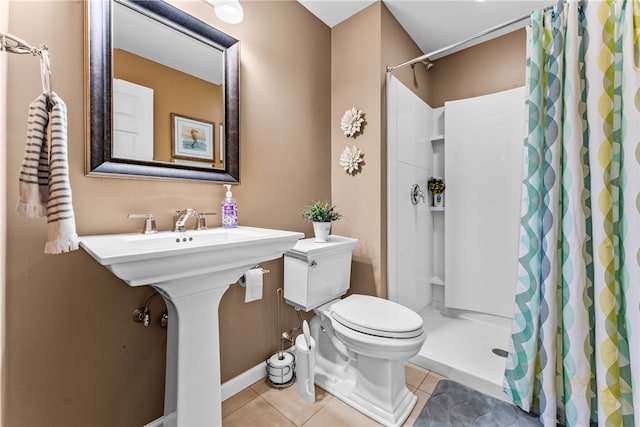 bathroom featuring walk in shower, tile patterned flooring, and toilet