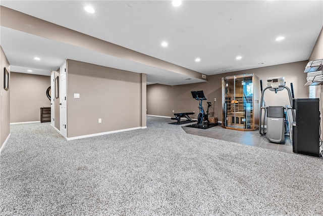 workout area featuring light carpet