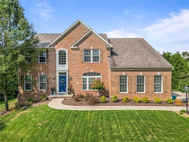 view of front of home with a front lawn