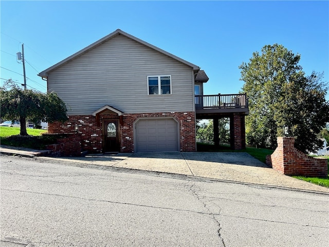 front of property featuring a garage and a wooden deck