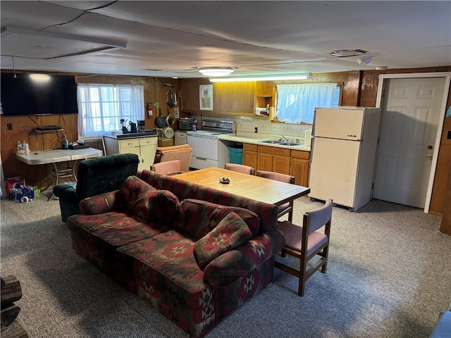 262 Shelby Ln, Northampton Township, PA 15538 - kitchen with freestanding refrigerator, a sink, electric range, and light colored carpet