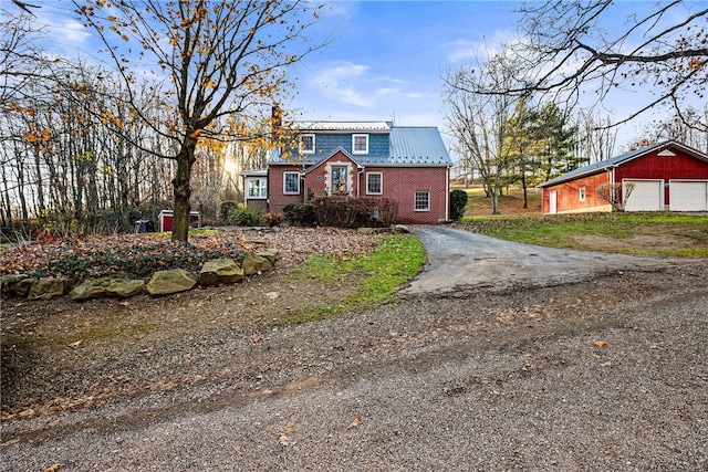 view of front of home with an outbuilding and a garage