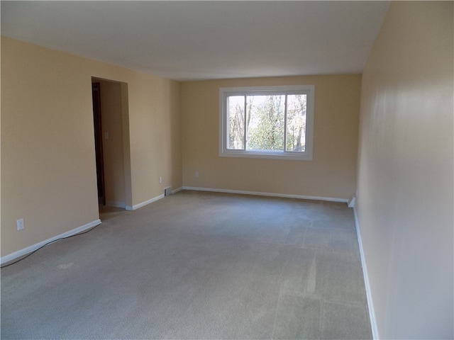 empty room with light colored carpet