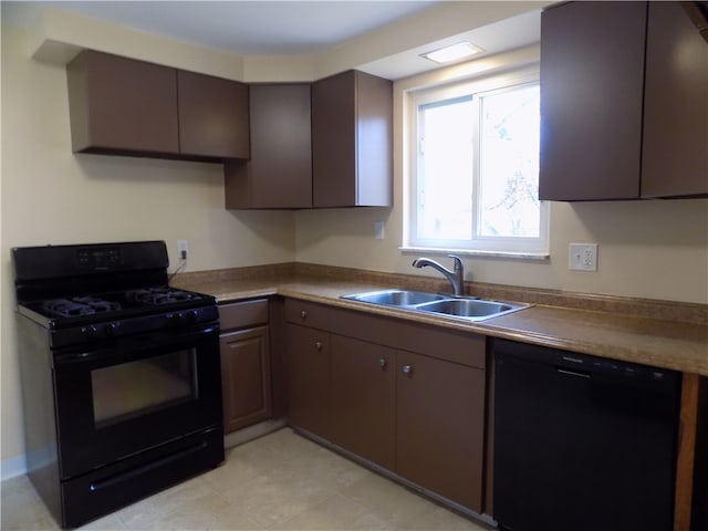 kitchen featuring black appliances, sink, and dark brown cabinets