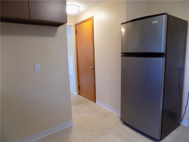 kitchen featuring stainless steel refrigerator