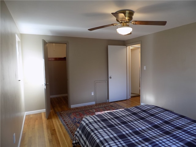 unfurnished bedroom featuring a closet, ceiling fan, and hardwood / wood-style flooring