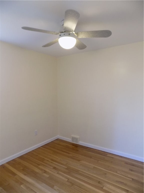 unfurnished room with ceiling fan and light hardwood / wood-style flooring