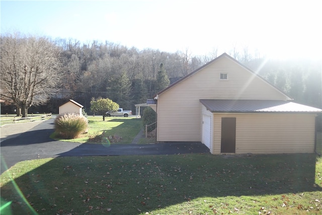 view of home's exterior with a yard