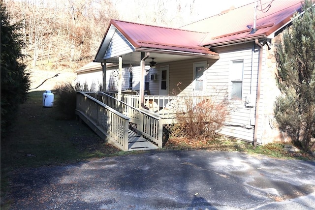 497 Pike Run Dr, W Pike Run Twp, PA 15427 - view of property exterior with covered porch, ceiling fan, and metal roof