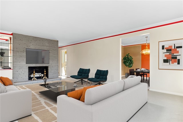 carpeted living room featuring a large fireplace and crown molding