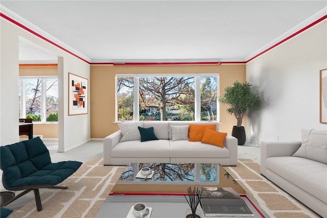 living room featuring light colored carpet, a healthy amount of sunlight, and crown molding