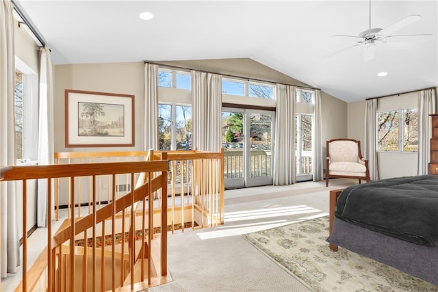 carpeted bedroom with lofted ceiling, multiple windows, and ceiling fan