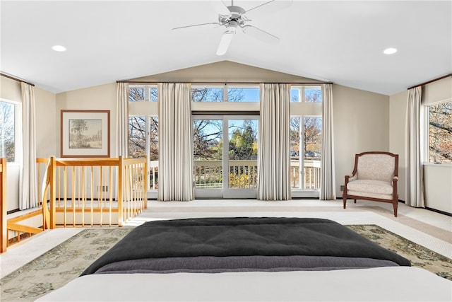 carpeted bedroom with vaulted ceiling and ceiling fan