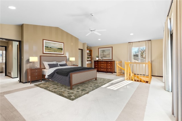 bedroom featuring ceiling fan, light carpet, and vaulted ceiling