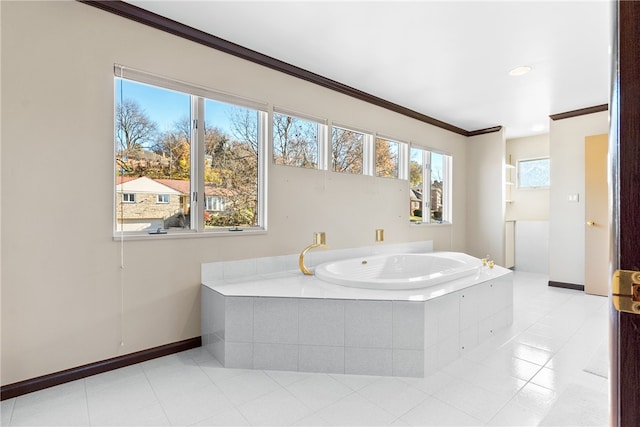 bathroom featuring tiled bath, tile patterned floors, and crown molding