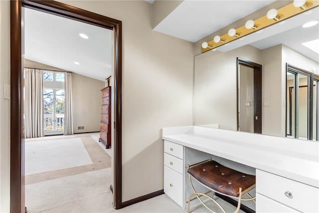 bathroom featuring vanity and vaulted ceiling