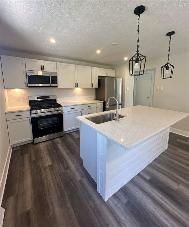 kitchen featuring white cabinets, sink, dark hardwood / wood-style floors, and stainless steel appliances