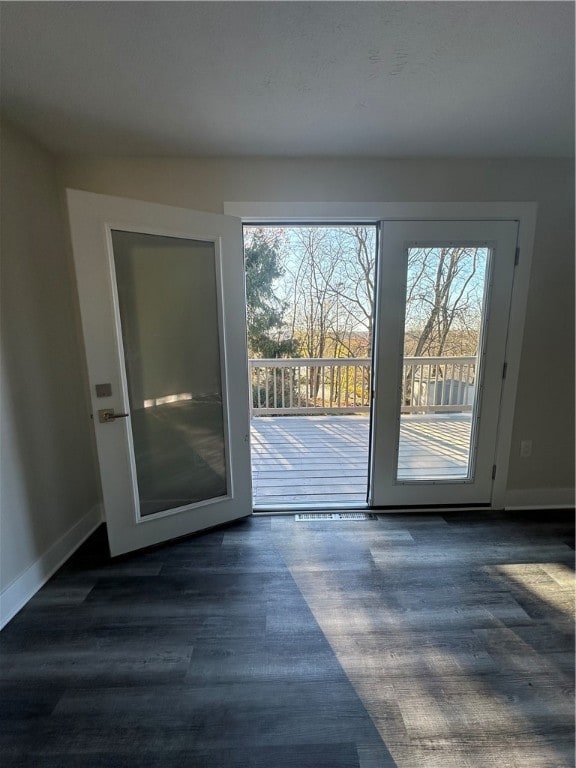 doorway with dark wood-type flooring