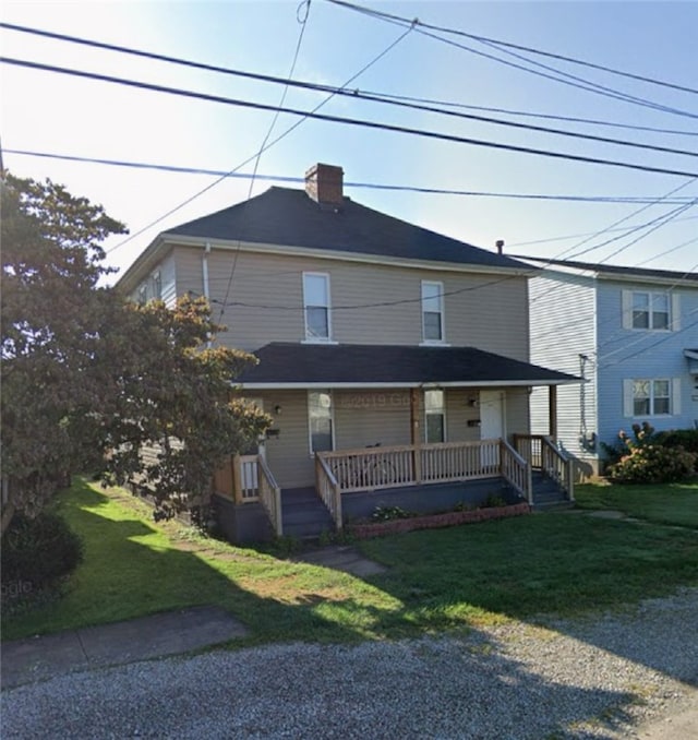 view of front of house featuring a porch and a front yard