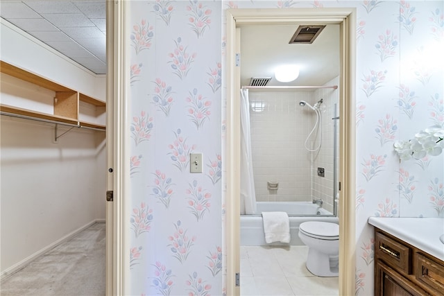 full bathroom featuring vanity, tile patterned floors, toilet, and shower / tub combo with curtain