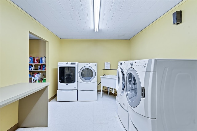 laundry room with washing machine and clothes dryer