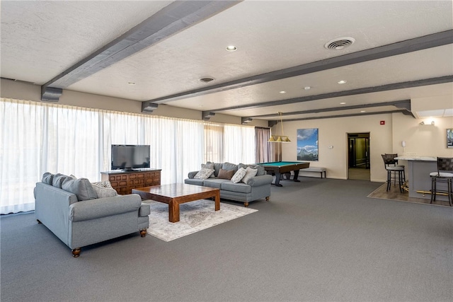 living room with beamed ceiling, a textured ceiling, billiards, and carpet