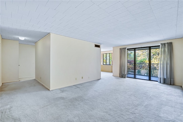 spare room with light colored carpet