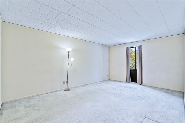 spare room with light carpet