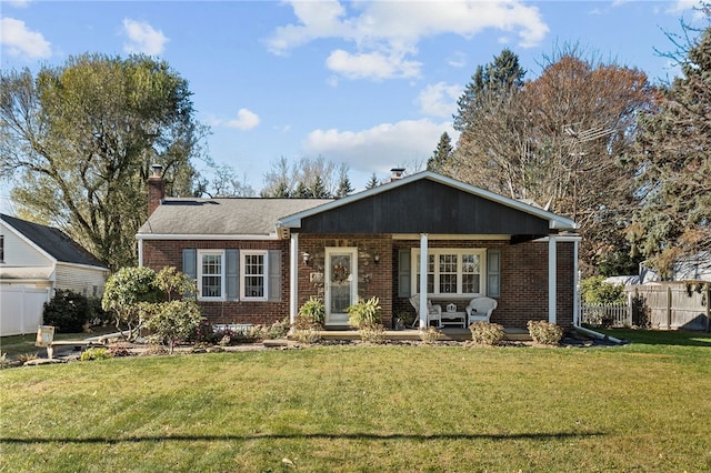 ranch-style house featuring a front lawn