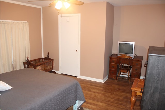 bedroom with dark wood-type flooring and ceiling fan