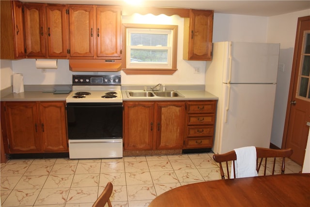 kitchen featuring sink and white appliances