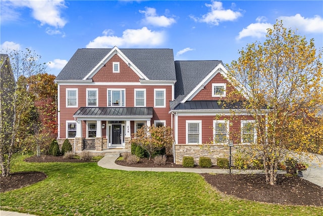 craftsman-style home with a front lawn