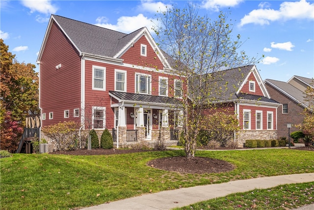 view of front of house featuring a porch, cooling unit, and a front yard