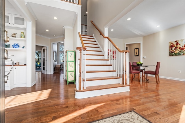 interior space featuring ornamental molding and hardwood / wood-style flooring