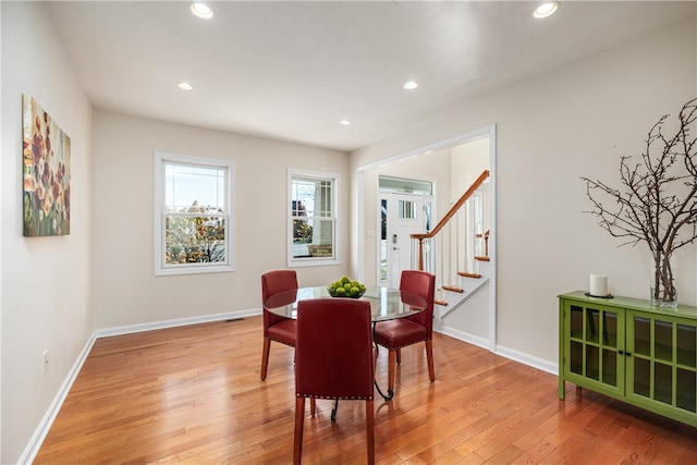 dining space with light wood-type flooring