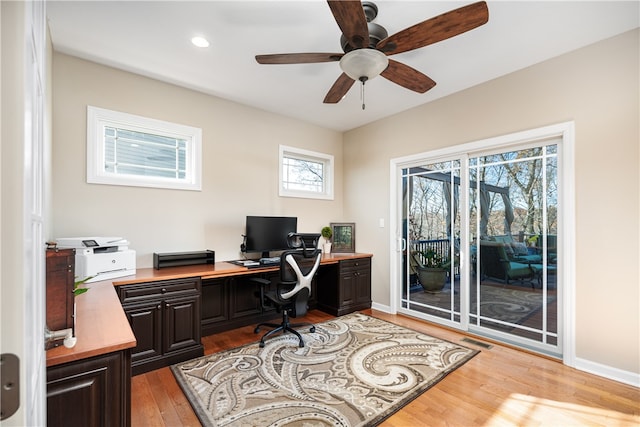 office space featuring hardwood / wood-style floors and ceiling fan