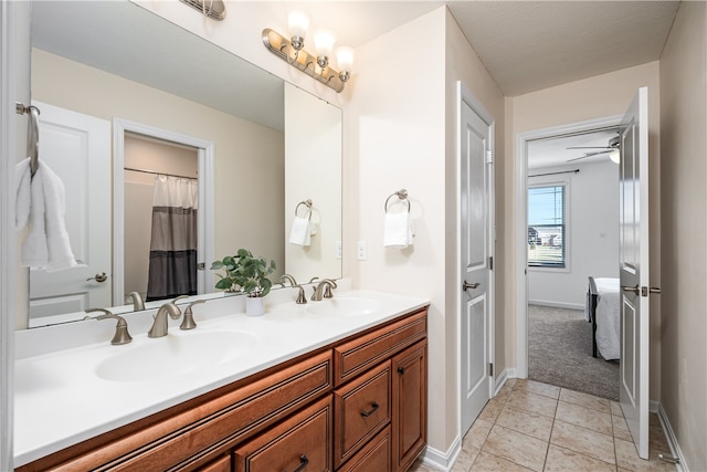 bathroom featuring vanity, tile patterned floors, and ceiling fan