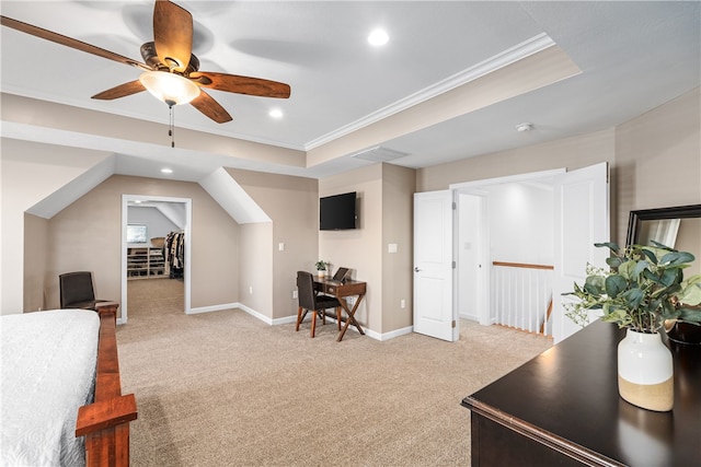 carpeted home office featuring ornamental molding, ceiling fan, and a raised ceiling