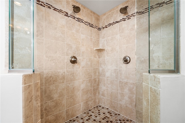 bathroom with tiled shower