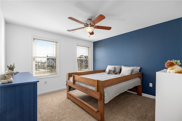 bedroom featuring light colored carpet and ceiling fan