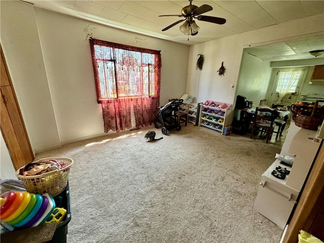 misc room featuring carpet and ceiling fan