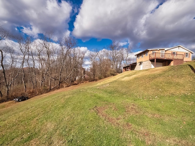 view of yard with a wooden deck