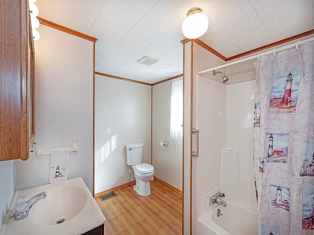 full bathroom featuring wood-type flooring, ornamental molding, vanity, toilet, and shower / bathtub combination with curtain