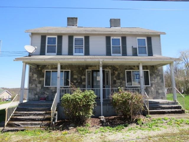 57-59 2nd St, Carmichaels/Cumblnd, PA 15325 - view of front of house featuring a porch and stone siding