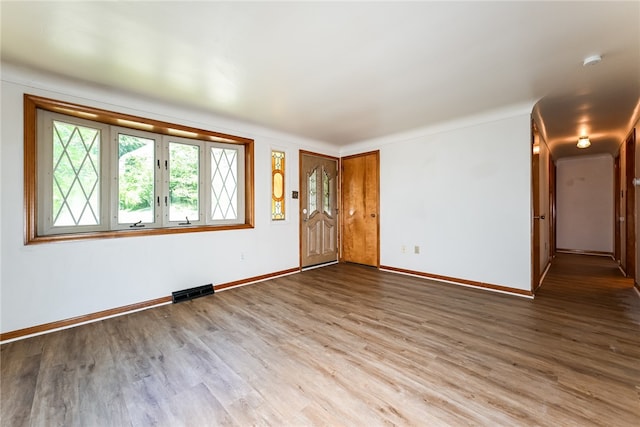 spare room with hardwood / wood-style floors