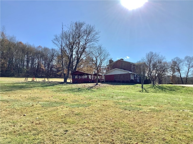 view of yard with a rural view