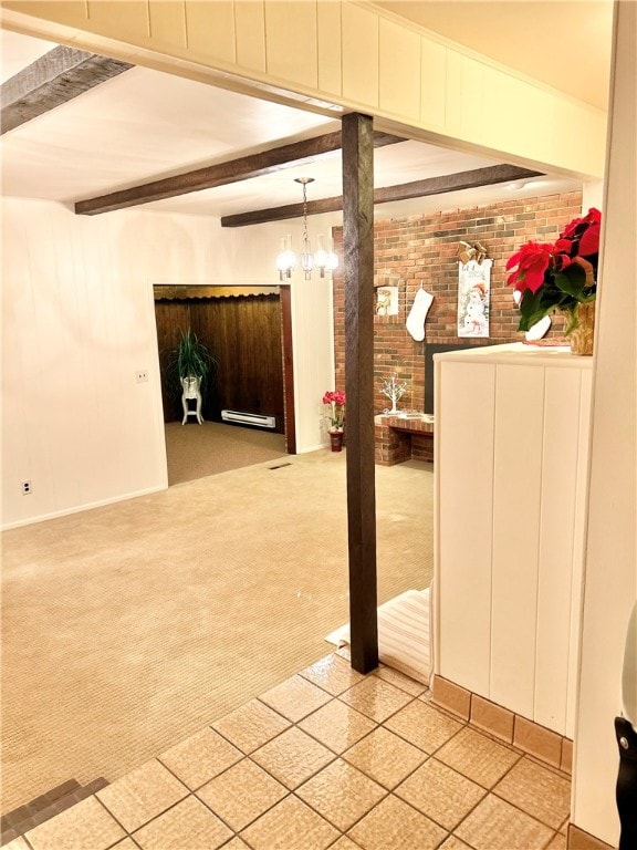 basement with brick wall, light colored carpet, a baseboard radiator, and a chandelier