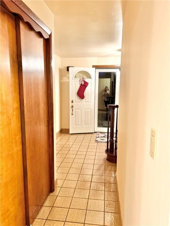 corridor with light tile patterned floors