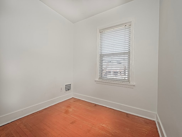 empty room featuring hardwood / wood-style floors